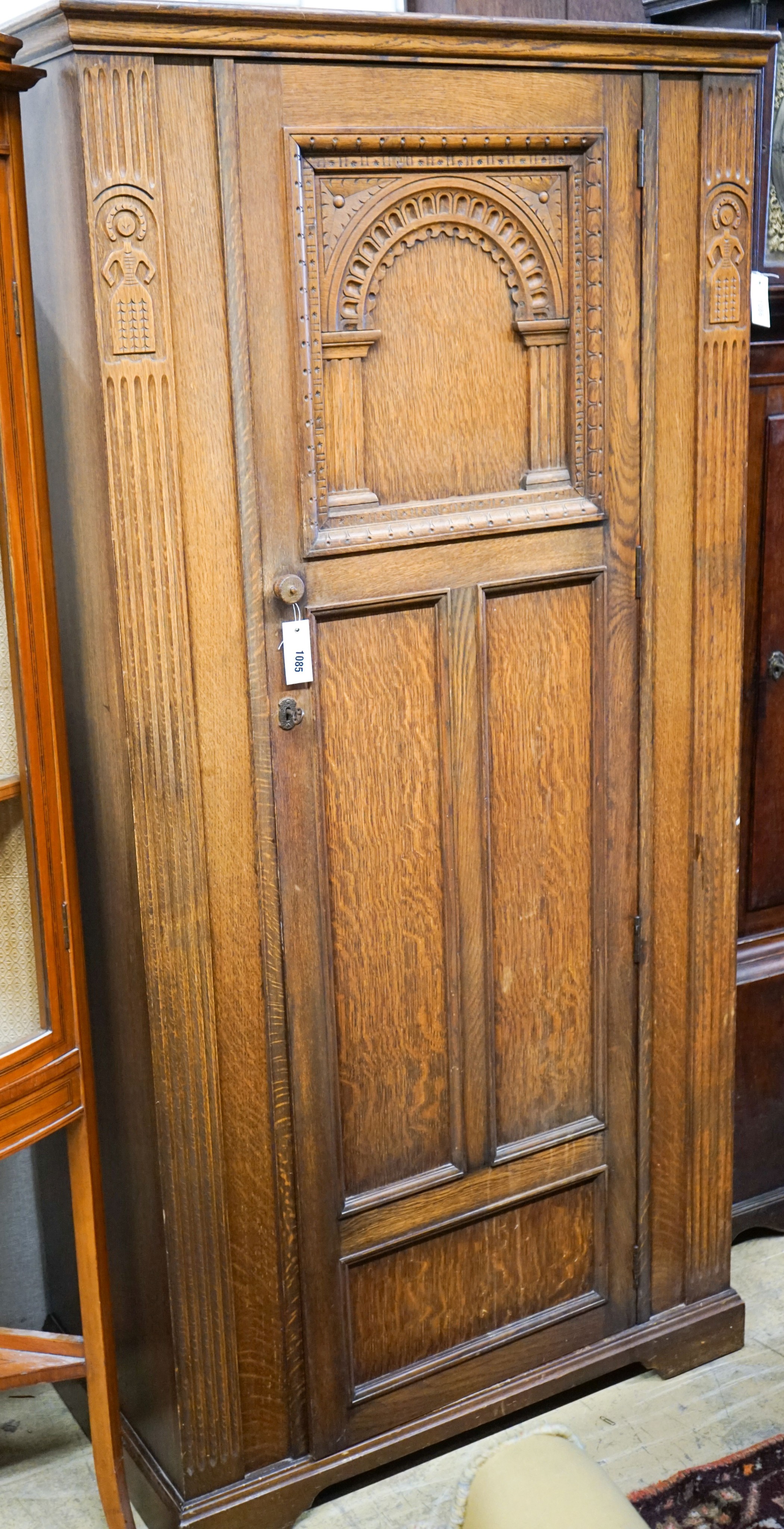 An 18th century style carved oak hall cupboard, length 91cm, depth 50cm, height 180cm